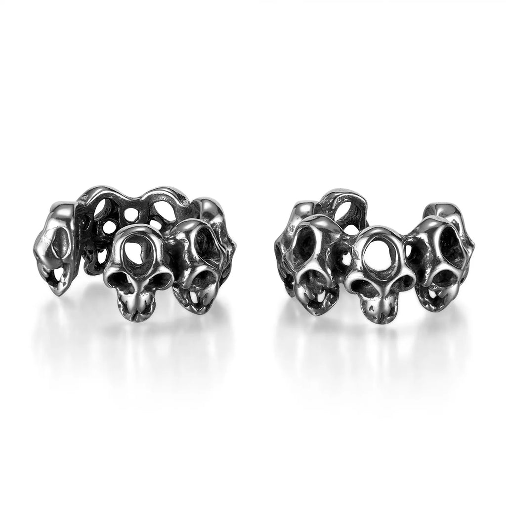Stainless steel skull earrings with hollow geometric design and clip-on style