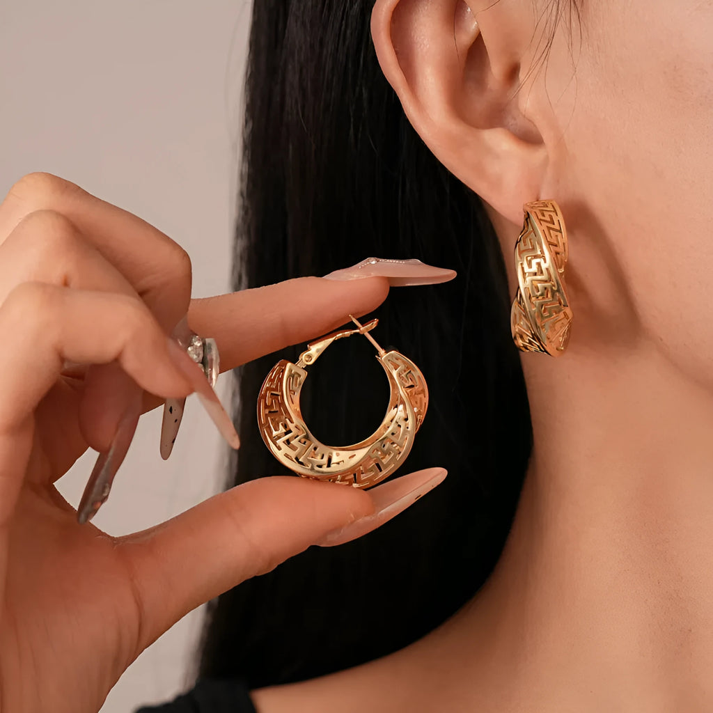 Geometric twisted round hollow stud earrings in gold or silver tone finish