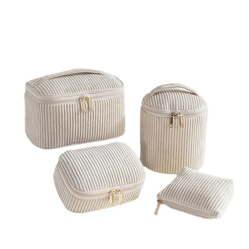 Set of four soft pink flannelette cube makeup bags with zips, arranged from largest to smallest.