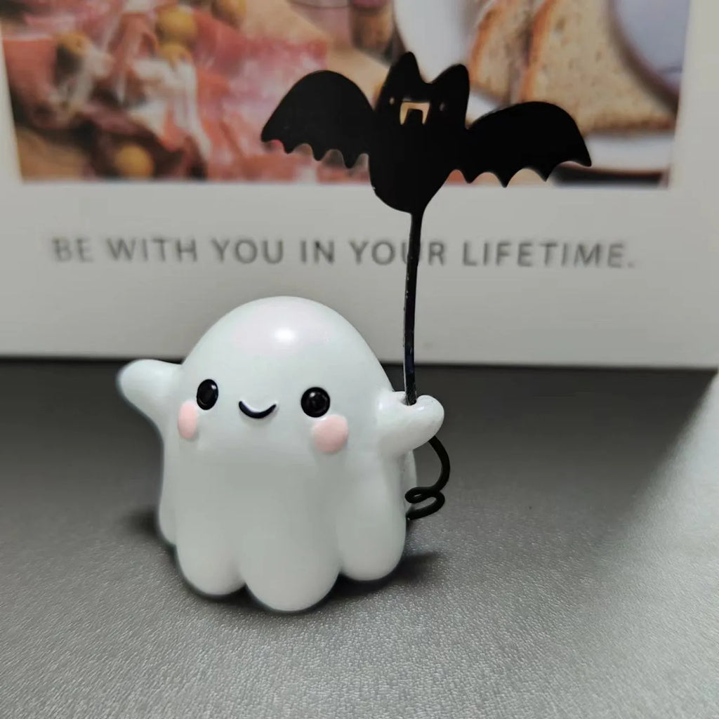 Mini resin Halloween statue of a cartoon ghost walking a bat, 4cm tall