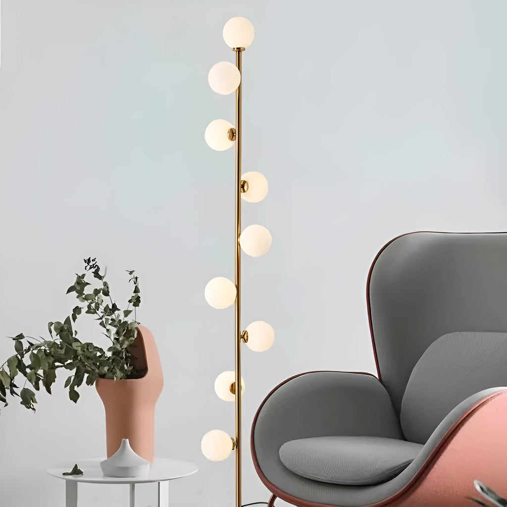Tall minimalist Nordic floor lamp with wrought iron stem, glass fittings, and a circular white marble base.