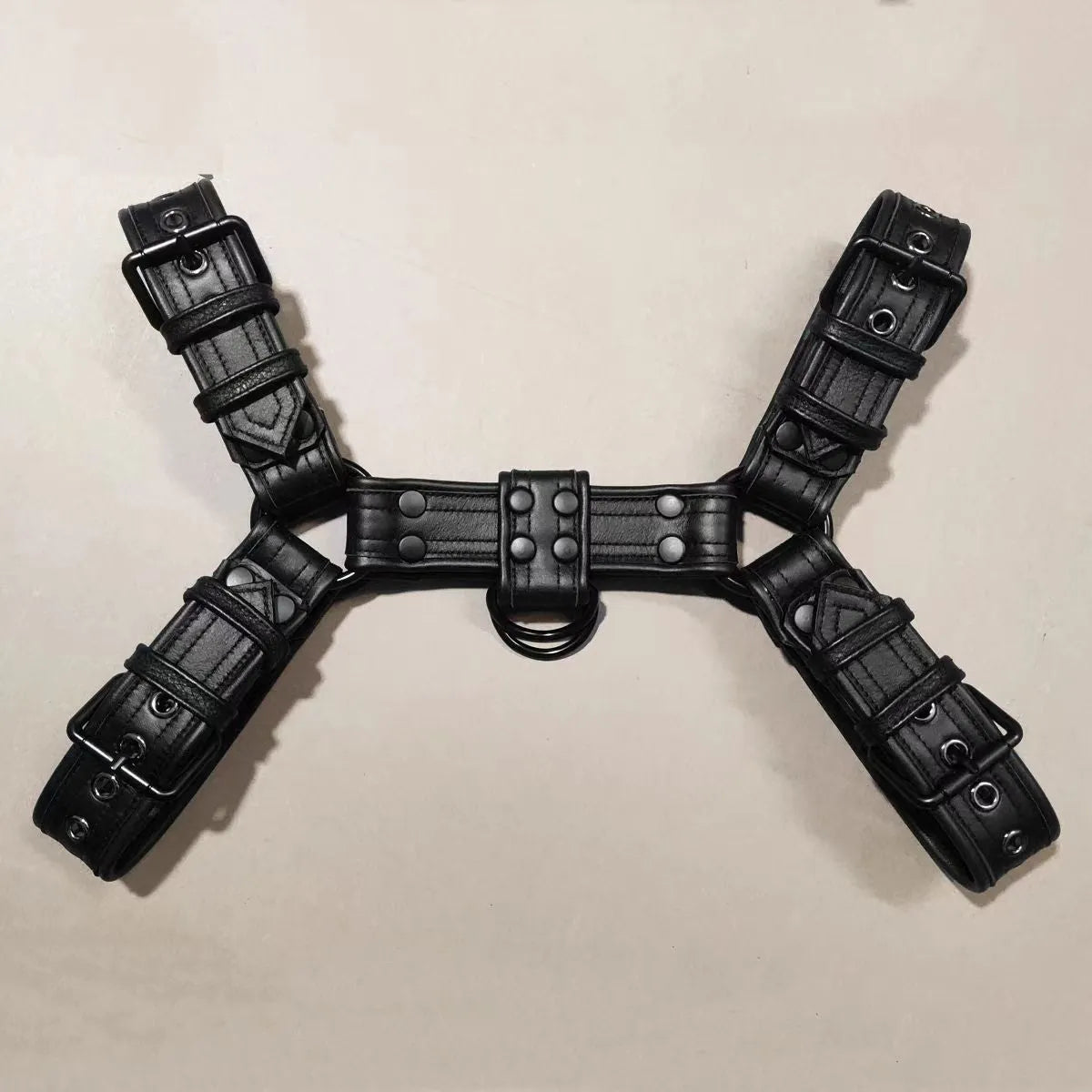Black leather chest muscle bondage strap with metal buckle adjustment for adult costume use