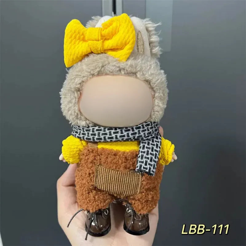 Plastic doll clothes for a 17cm tall vinyl figure on a white background.