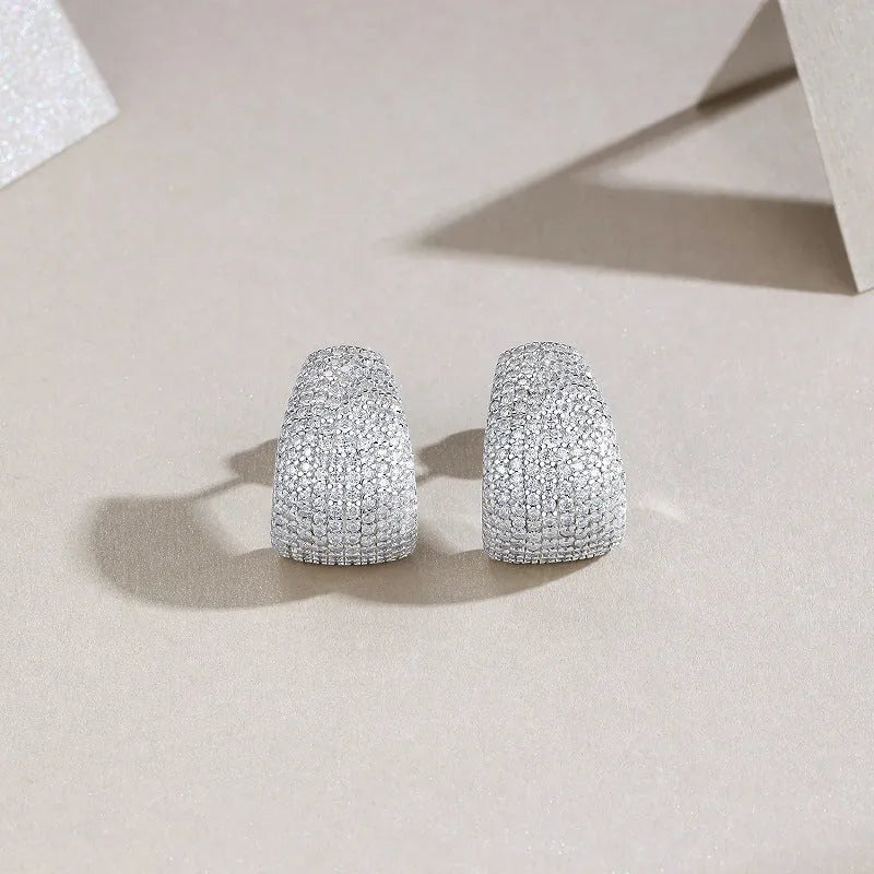 Geometric sterling silver stud earrings with a d-e colour moissanite stone.