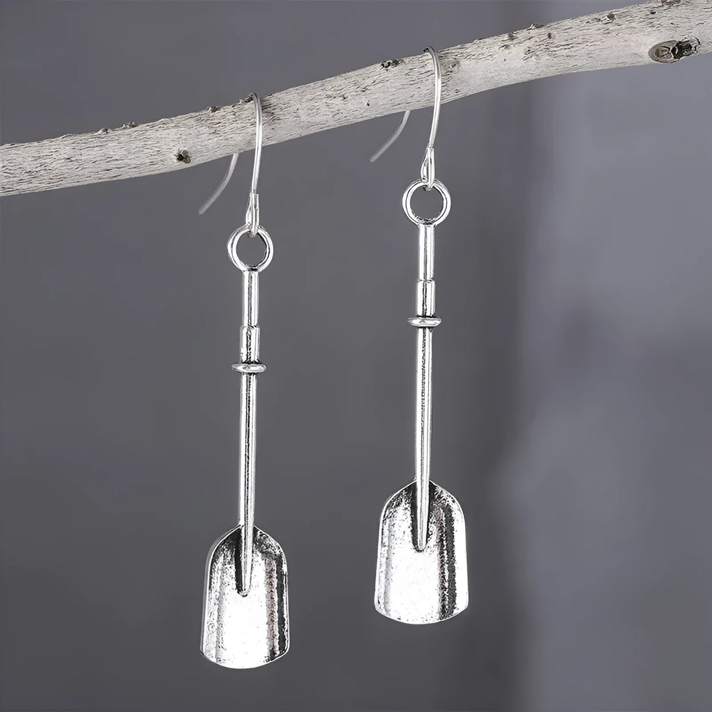 Long antique silver shovel-shaped drop earrings with a geometric retro design.