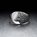 Men's silver alloy ring featuring a detailed geometric wolf design on a dark background.