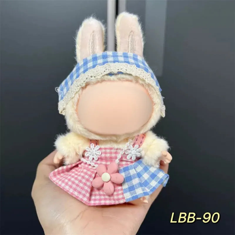 Plastic doll clothes for a 17cm tall vinyl figure on a white background.