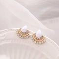 Retro silver geometric fan-shaped drop earrings with rhinestone and opal-style details.