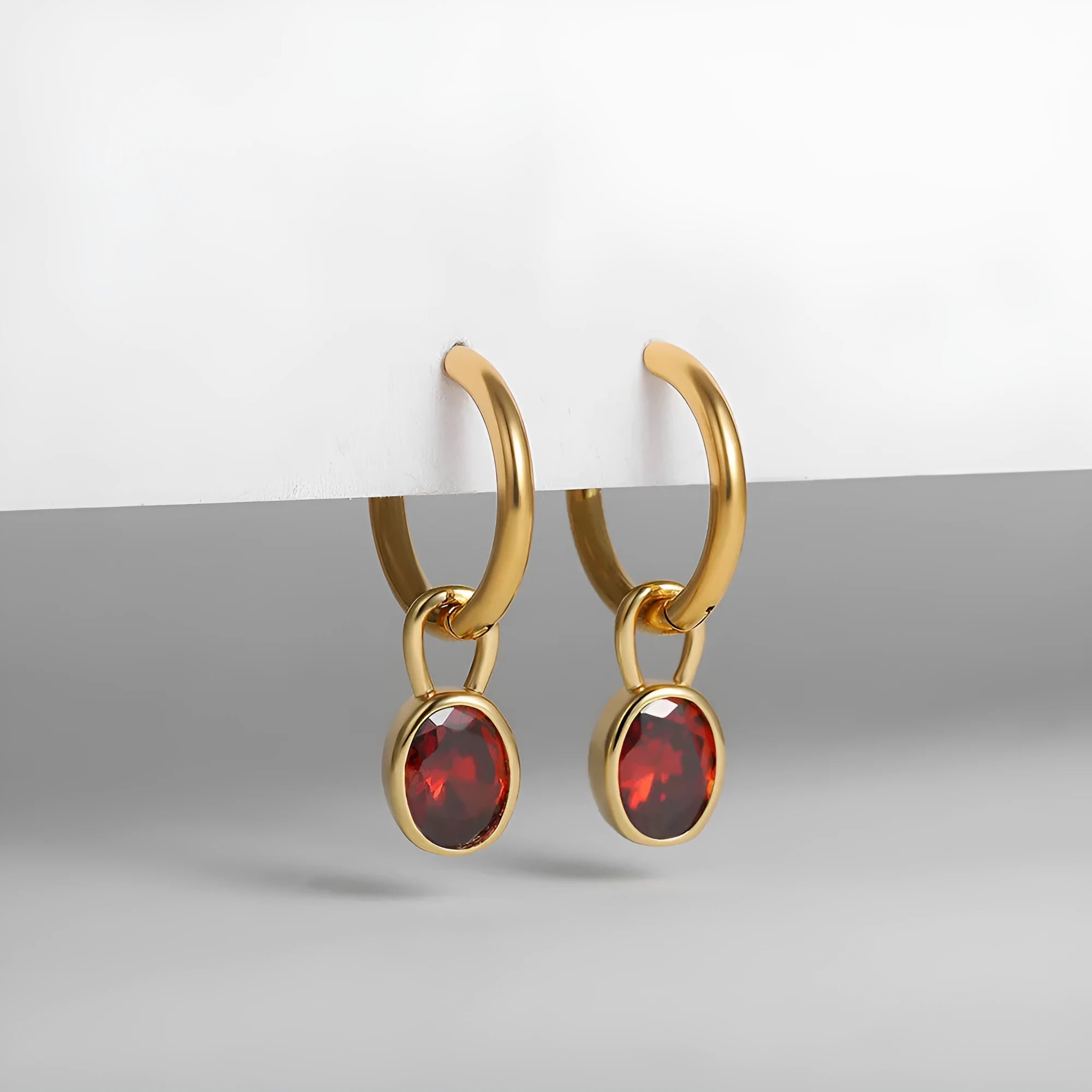 Close-up of women's copper oval zircon drop earrings in army green, showing post and clutch back.