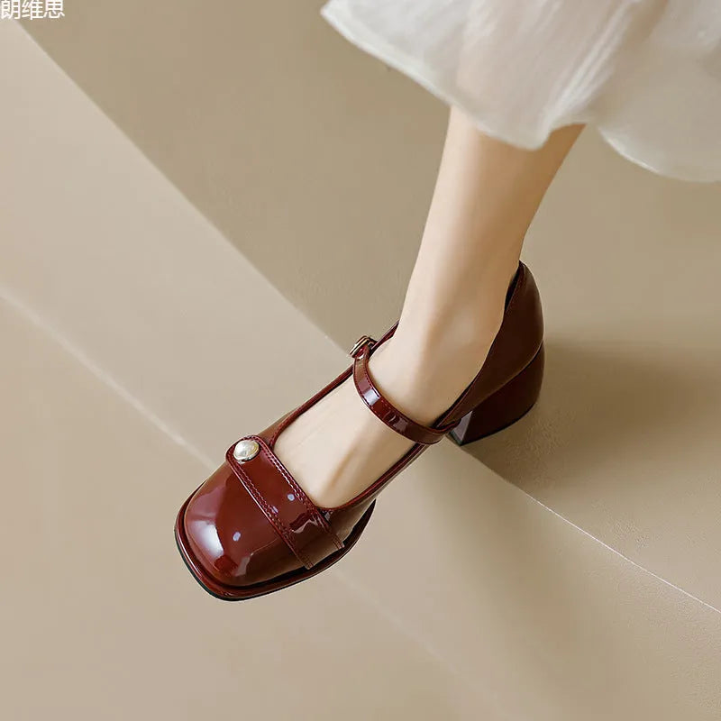 Plus size patent leather ankle boots with buckle and chunky heel in apricot, black, or wine red.