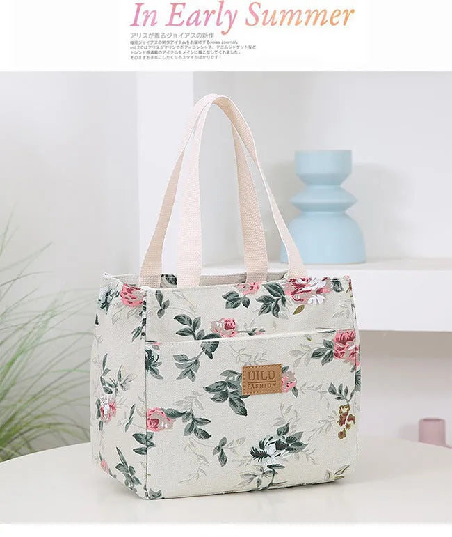 Women's large printed canvas tote bag with aluminium handles in a choice of floral and cat designs.