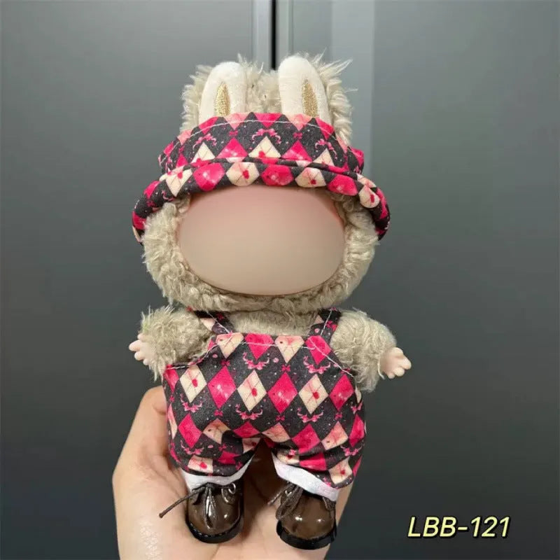 Plastic doll clothes for a 17cm tall vinyl figure on a white background.