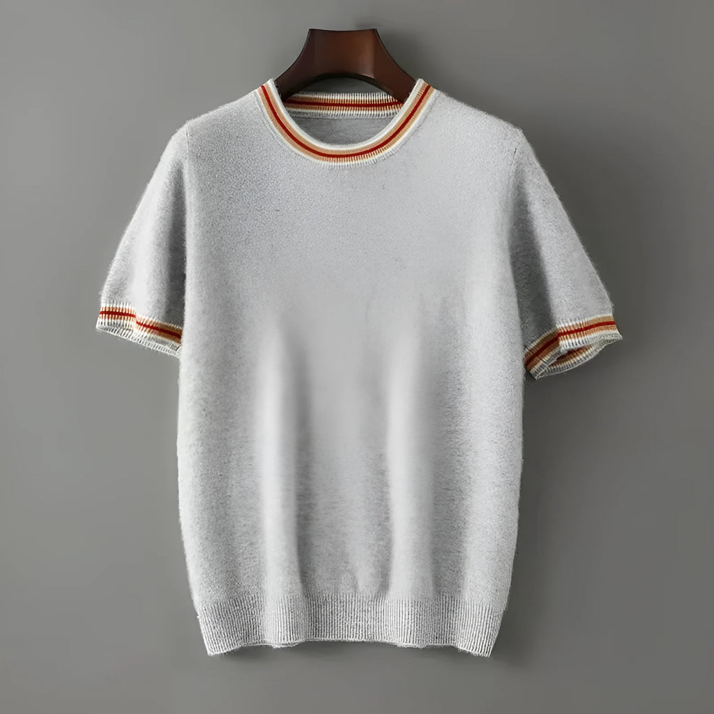 A man's short sleeve pure wool sweater with a round neck, shown in a neutral colour.