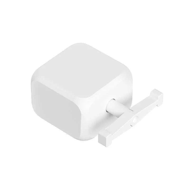 White Bluetooth rocker arm finger robot remote control on a surface.