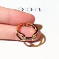 Golden copper geometric women's ring with inlaid zircon stone in Han style.