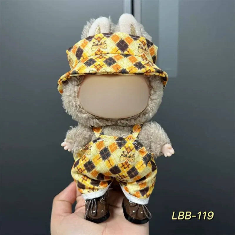 Plastic doll clothes for a 17cm tall vinyl figure on a white background.