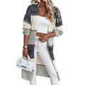 Grey stripe knitted long cardigan for women, loose fit with long sleeves on a hanger.