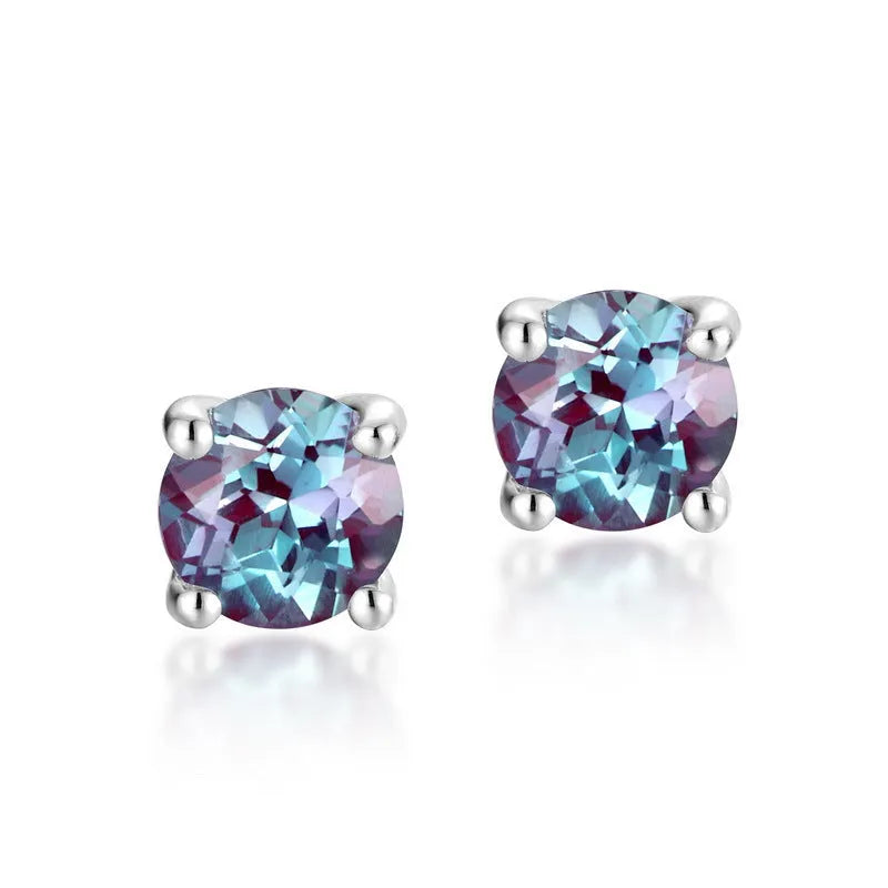 Simple geometric Alexander Stone ear studs in 925 silver with round design.