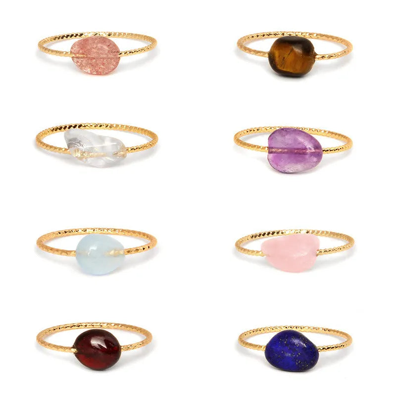 Women's geometric niche design ring with a coloured agate stone centrepiece.