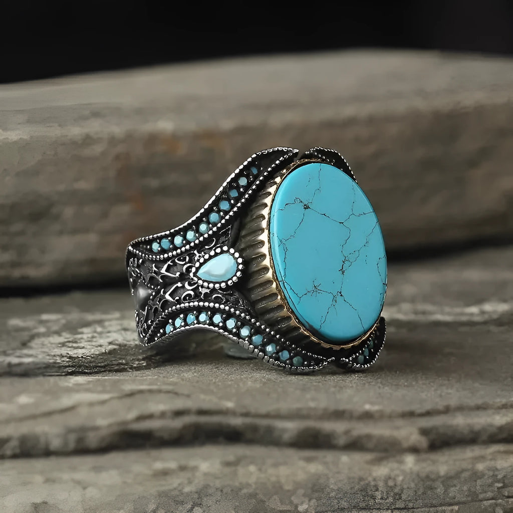 Men's round turquoise ring in antique silver alloy showing simple design and metallic finish