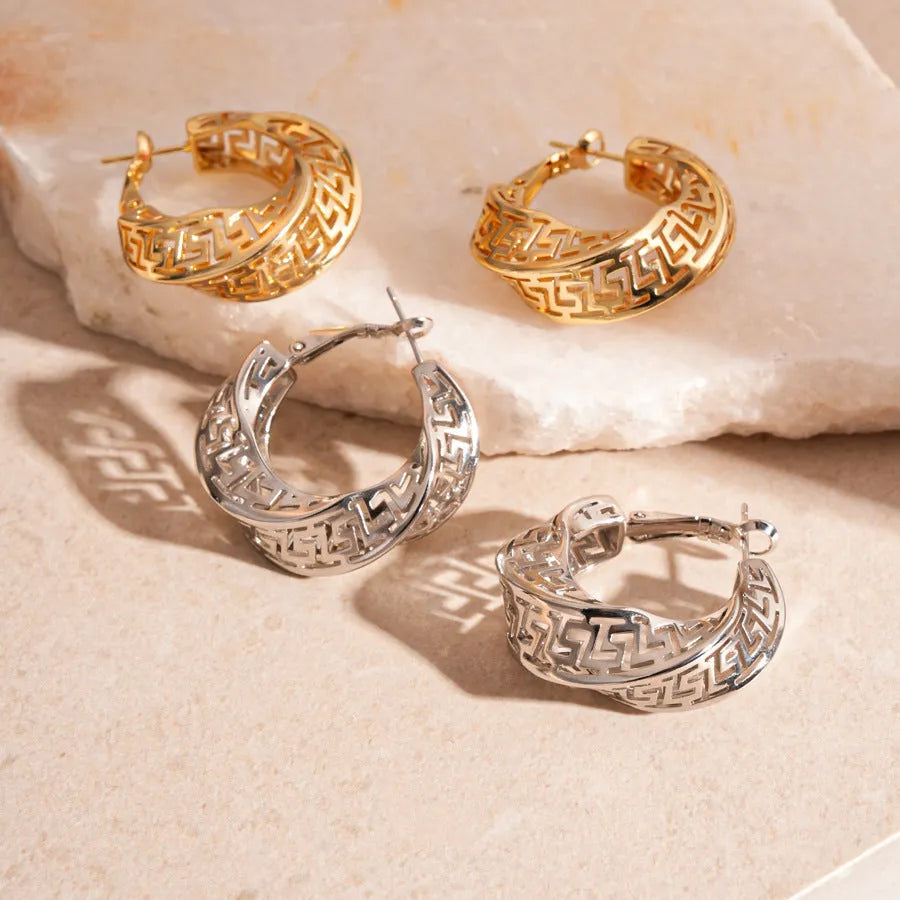 Geometric twisted round hollow stud earrings in gold or silver tone finish