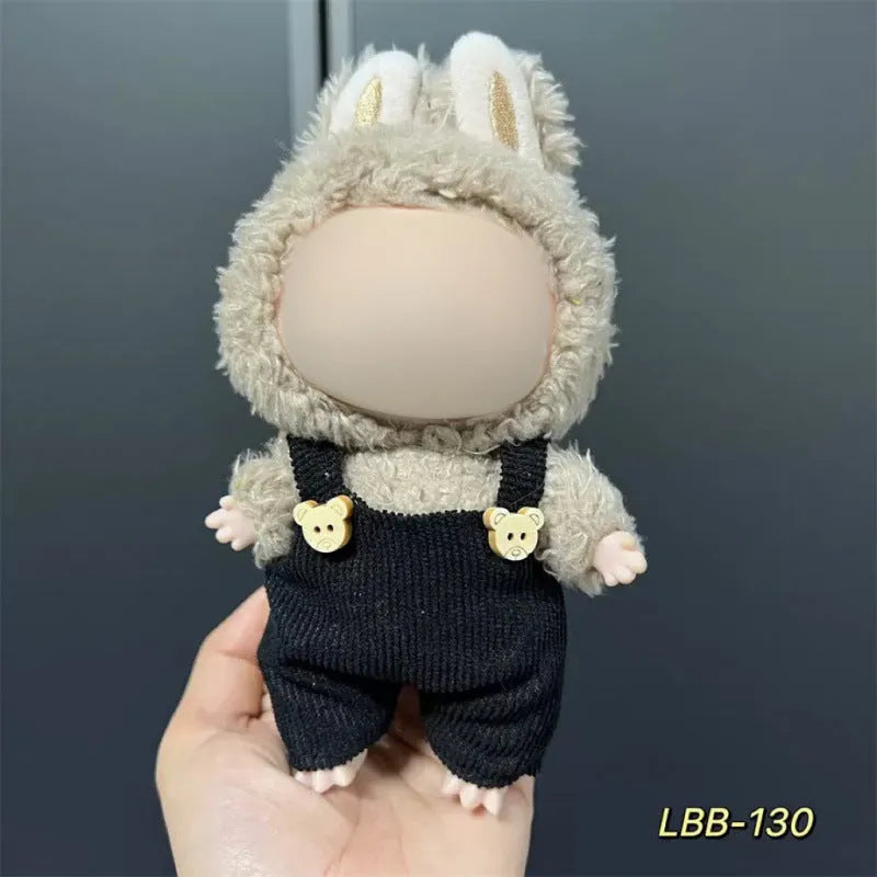 Plastic doll clothes for a 17cm tall vinyl figure on a white background.