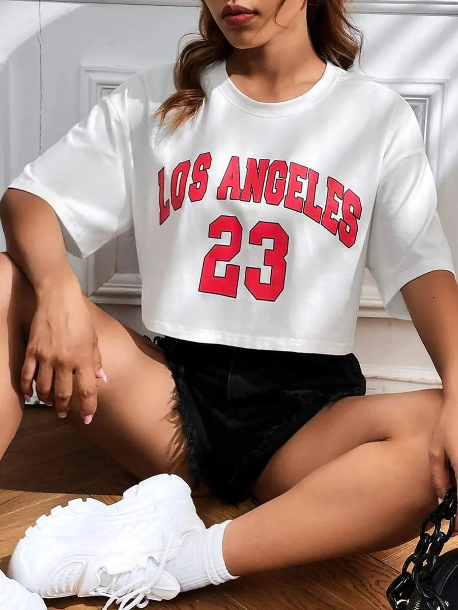 Black personalised '23 Letters' printed cotton T-shirt with loose fit and exposed navel style on a mannequin.