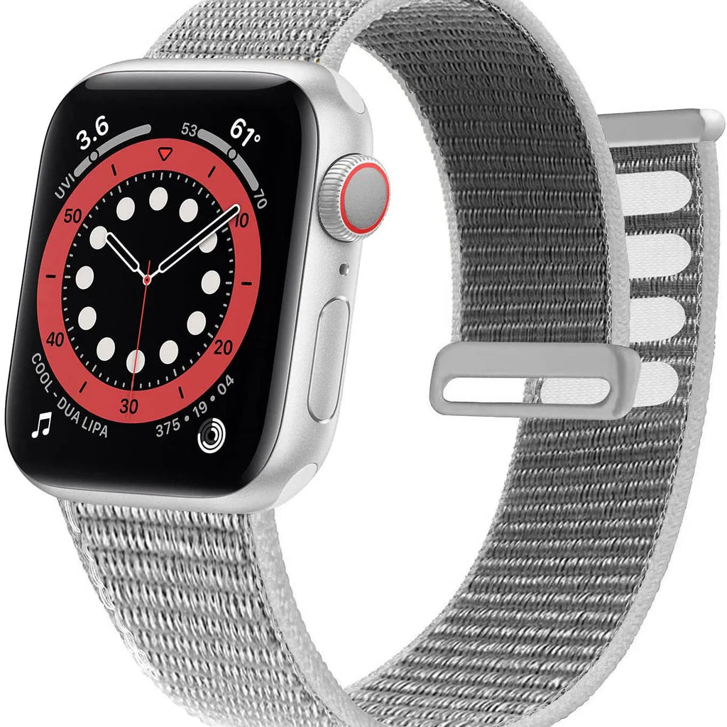 Woven nylon smartwatch strap in pink sand colour, shown detached from a watch.