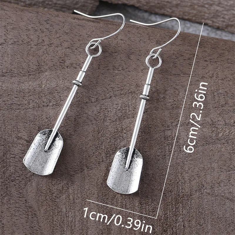 Long antique silver shovel-shaped drop earrings with a geometric retro design.