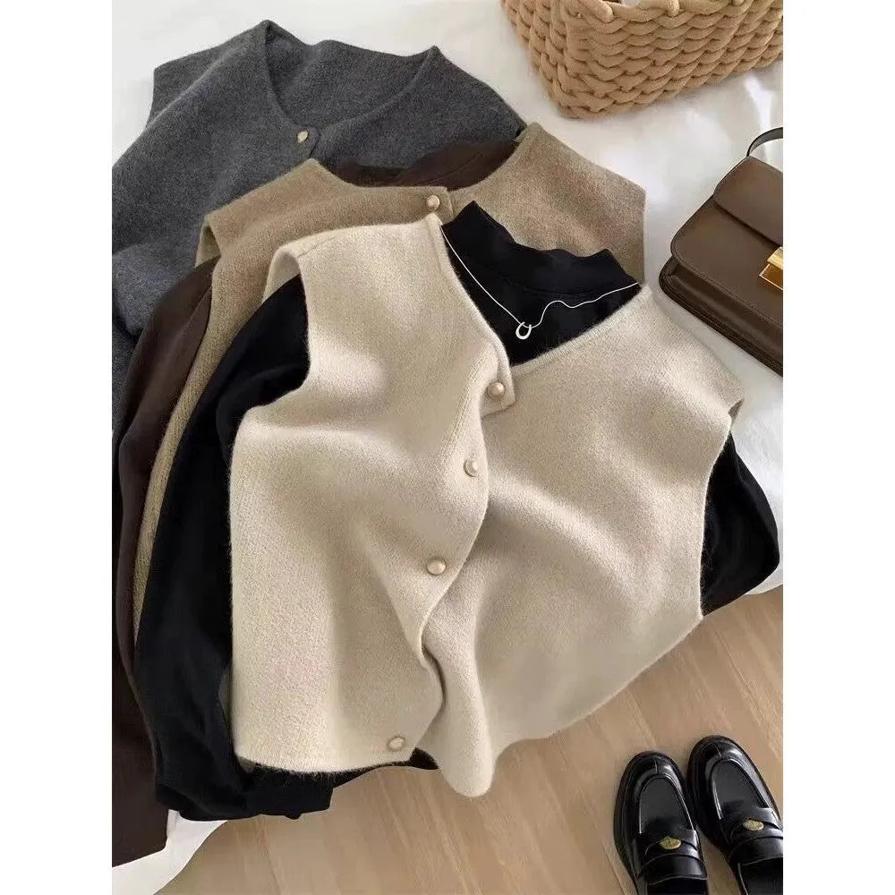 Women's thin grey polyester pullover vest with half sleeves, shown as a casual layering piece.