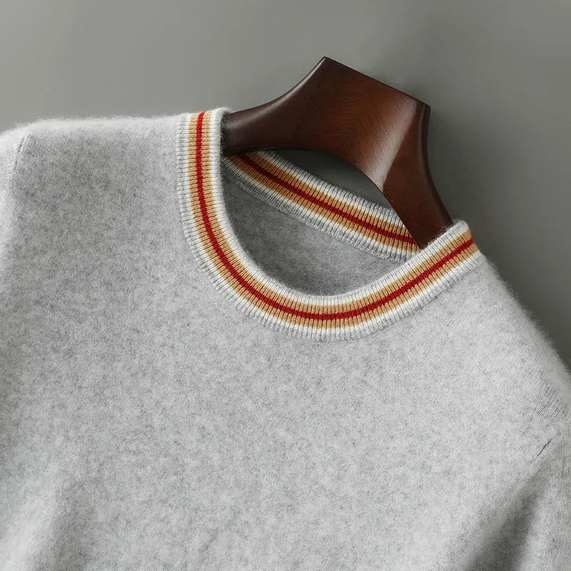 A man's short sleeve pure wool sweater with a round neck, shown in a neutral colour.