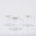Transparent spill-proof lightweight plastic drinking cup on a table.