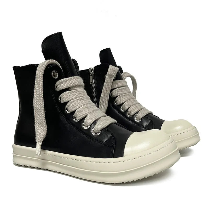 Black high-top genuine leather boots with side zip detail on a white background.