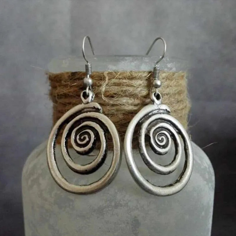 Retro geometric spiral earrings with distressed silver finish measuring 2.6cm by 5cm
