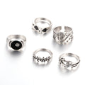 Black alloy poker ring with raised spade card design on band