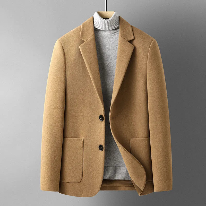 Men's slim-fit wool suit jacket in grey on a hanger.