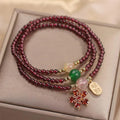 Women's natural crystal bracelet in pomegranate red cherry blossom colour with sequins detailing