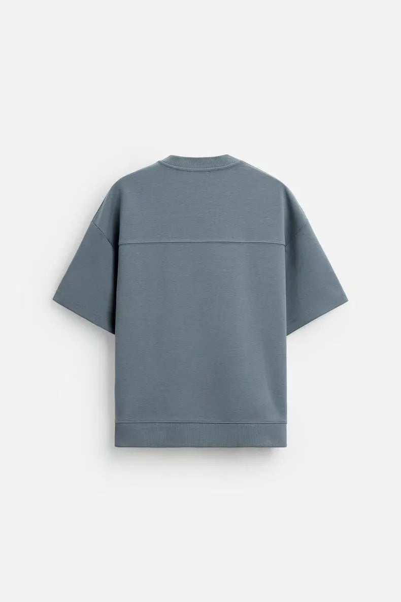 Loose double-sided cloth texture short sleeve shirt and matching shorts casual set on a hanger.
