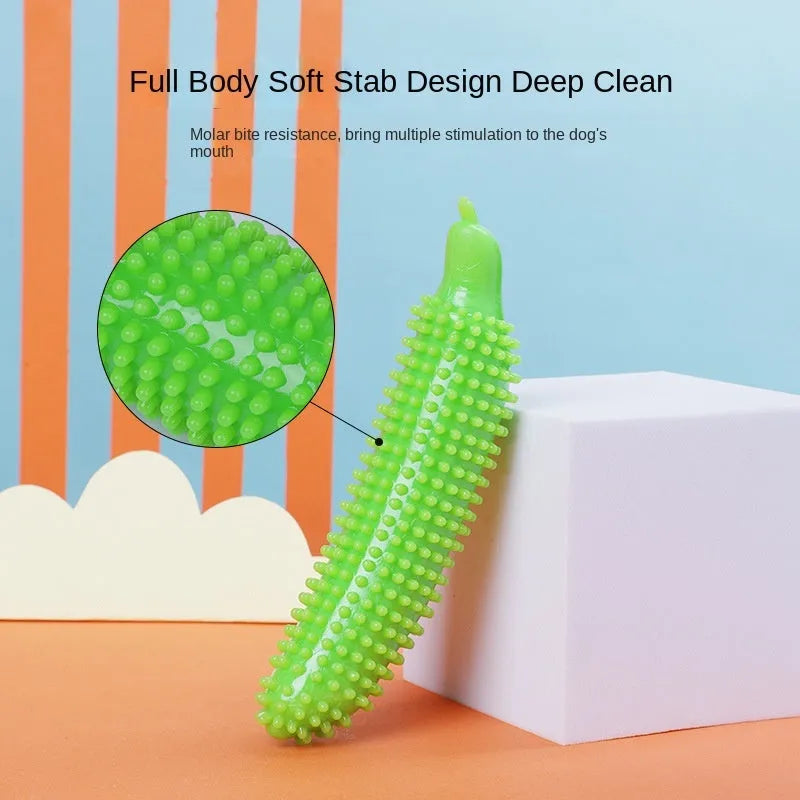 Green cucumber-shaped dog chew toy on a plain background.