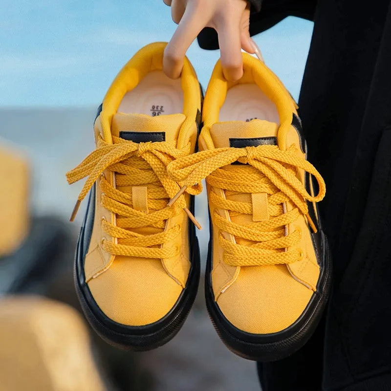 Women's low-top lace-up board shoes in blue, white black, black and white, and yellow black colour options