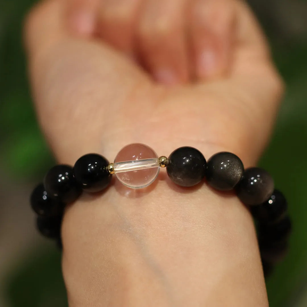 White crystal bracelet with cat eye obsidian details in Chinese geometric style