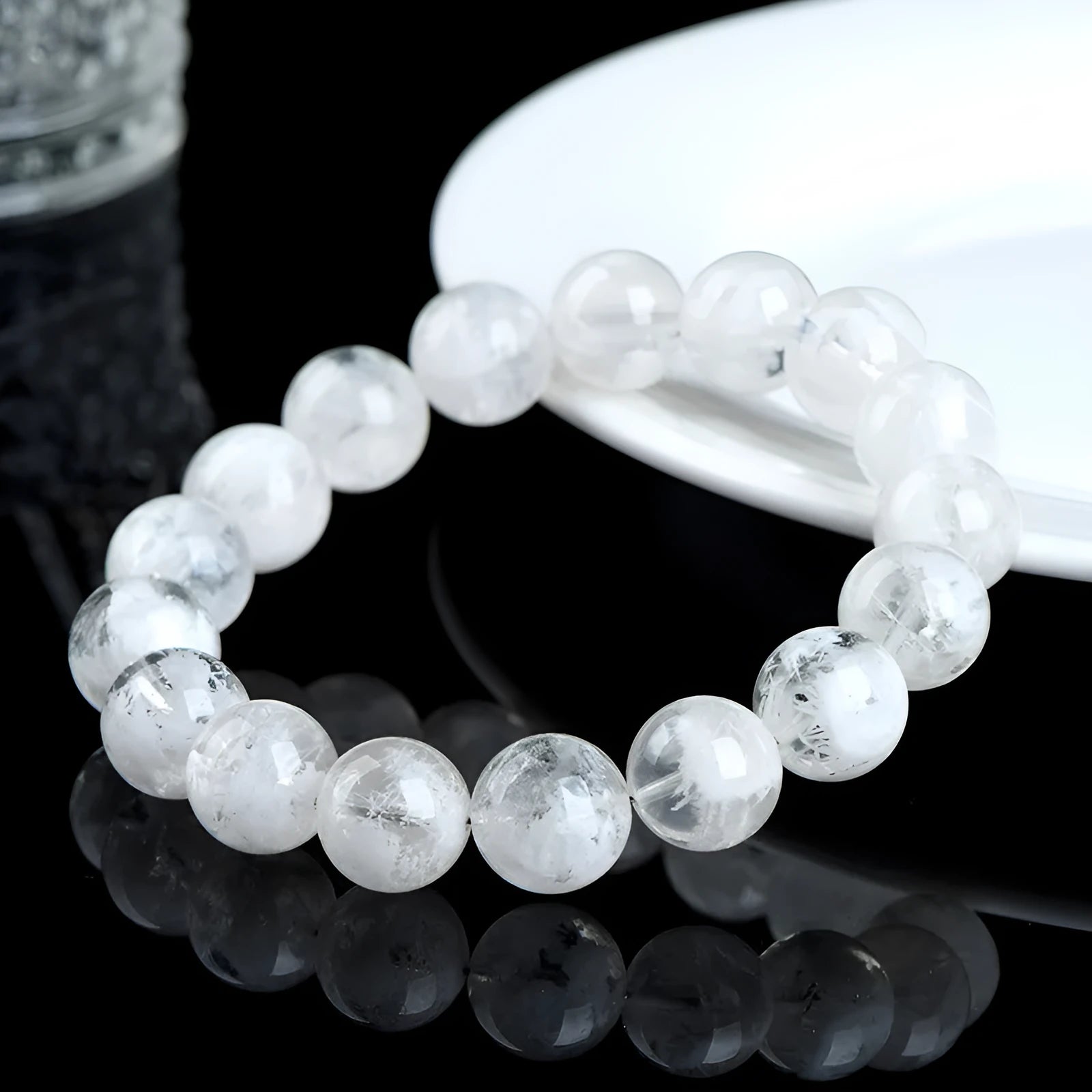 Women's crystal bracelet with round blizzard snowflake beads and traditional Ruyi and Xiangyun symbols.