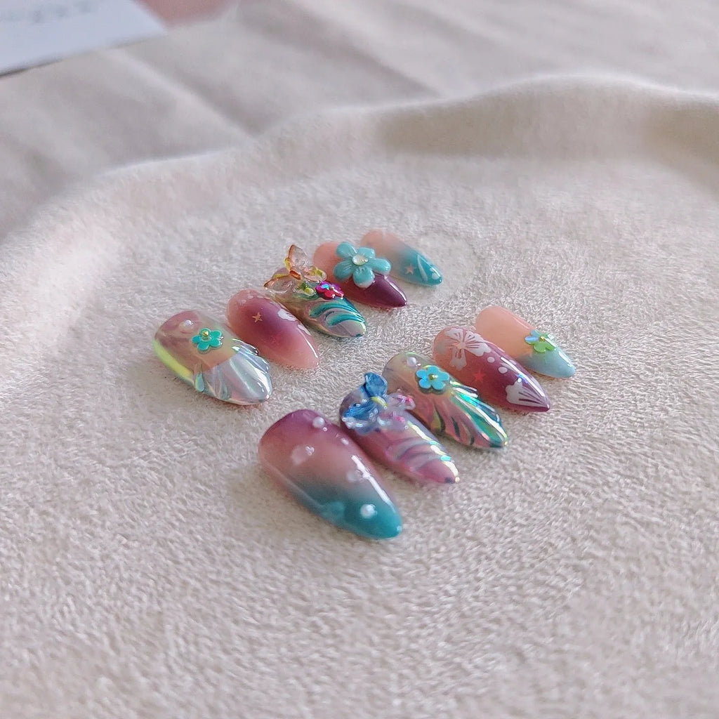 Handmade colourful flower and butterfly nail art decorations in four sizes