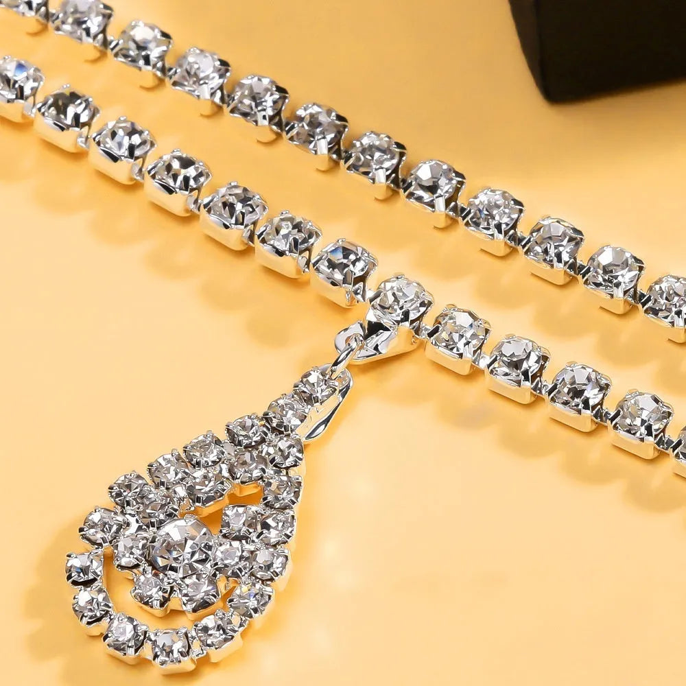 Gold and silver rhinestone waist chain for women with water drop pendant and lobster buckle.