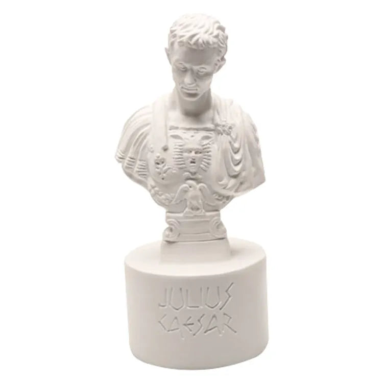White synthetic resin pen holder with American character sculpture design for holding pens on a desk.