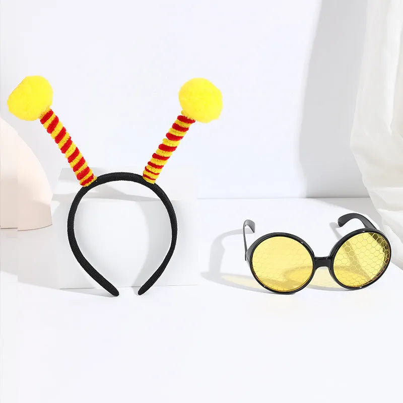 Yellow children's bee costume headband and matching bug-eye glasses for fancy dress parties.