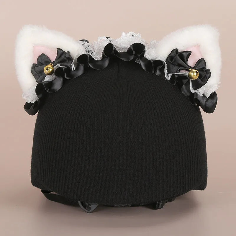 A soft plush cartoon character cover stretched over a medium-sized motorcycle helmet.