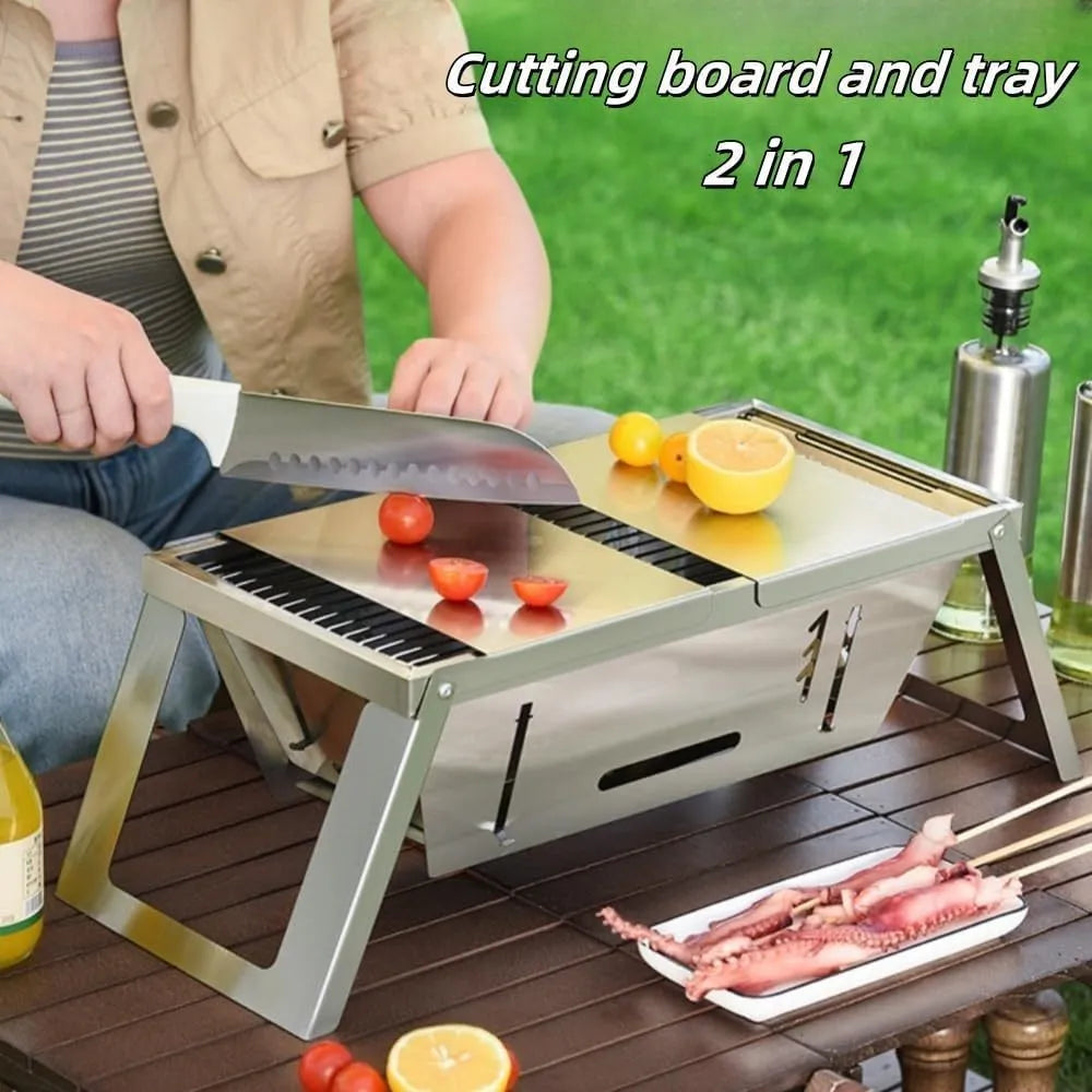 Small foldable portable charcoal grill shown in an outdoor setting.