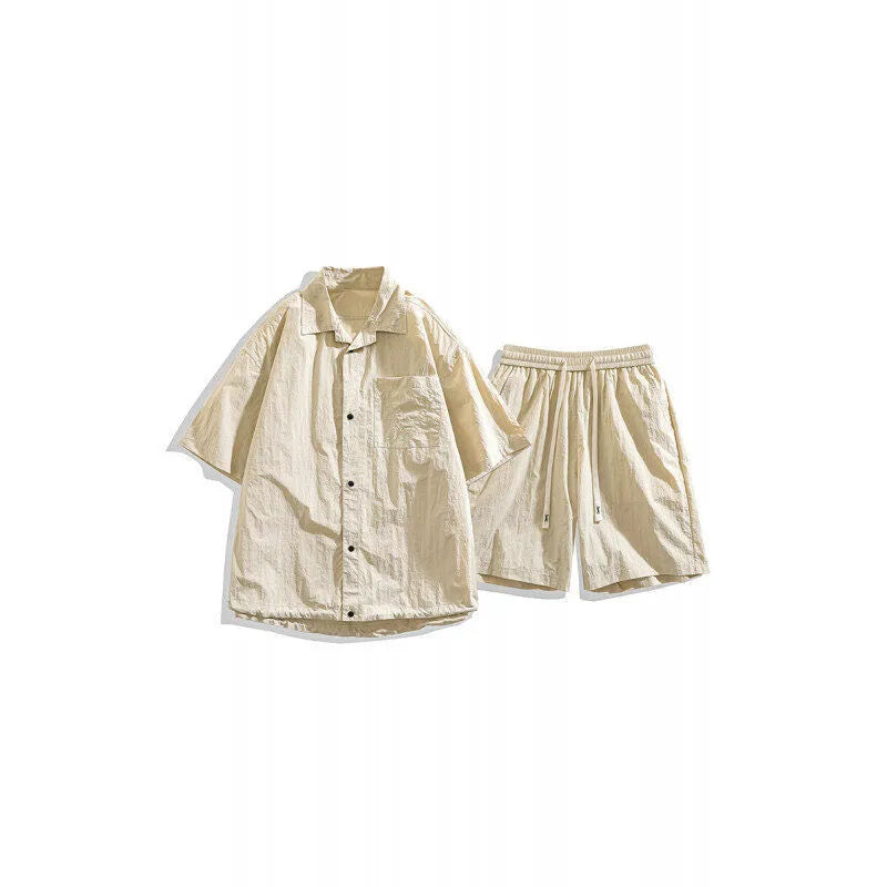 Men's loose casual shirt and matching shorts two-piece set in a light grey colour.