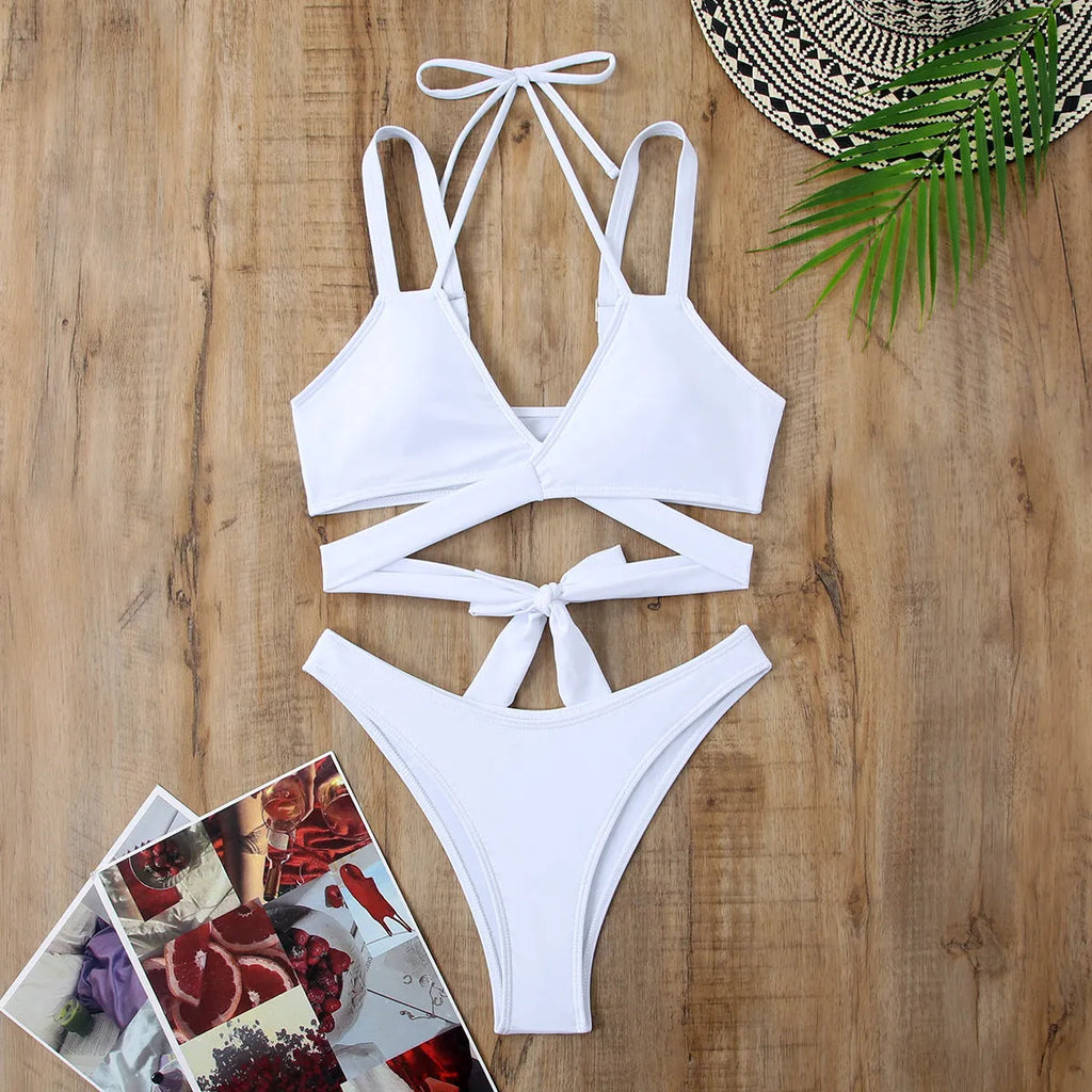 Women's solid colour strap bikini swimsuit on a mannequin, shown in black.